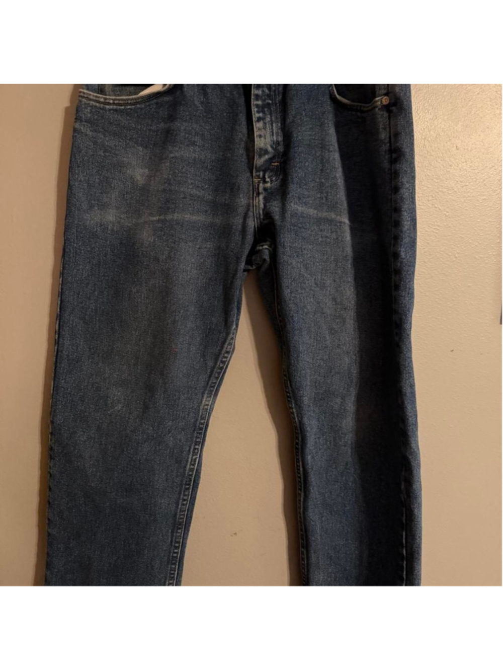 Wrangler medium wash denim jeans with a relaxed straight-leg fit